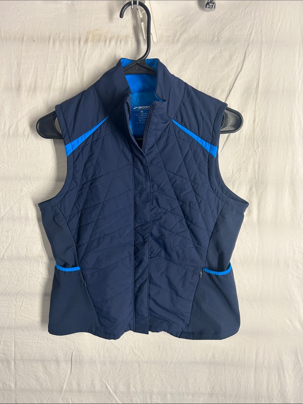 Brooks woman’s Navy Vest with Bright Blue Trim